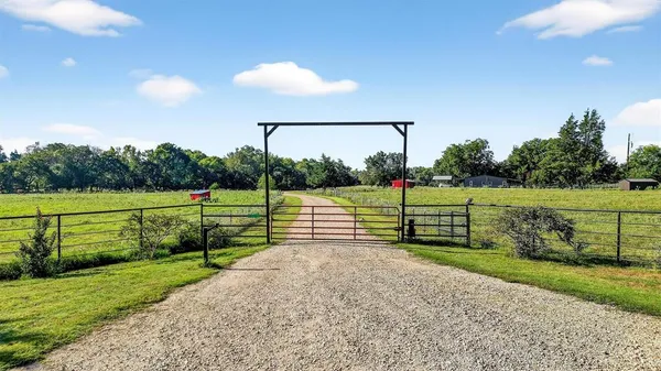 a view of park with wooden fence