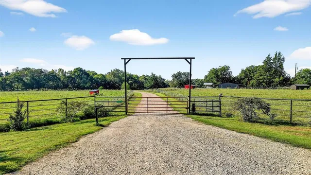 a view of park with wooden fence