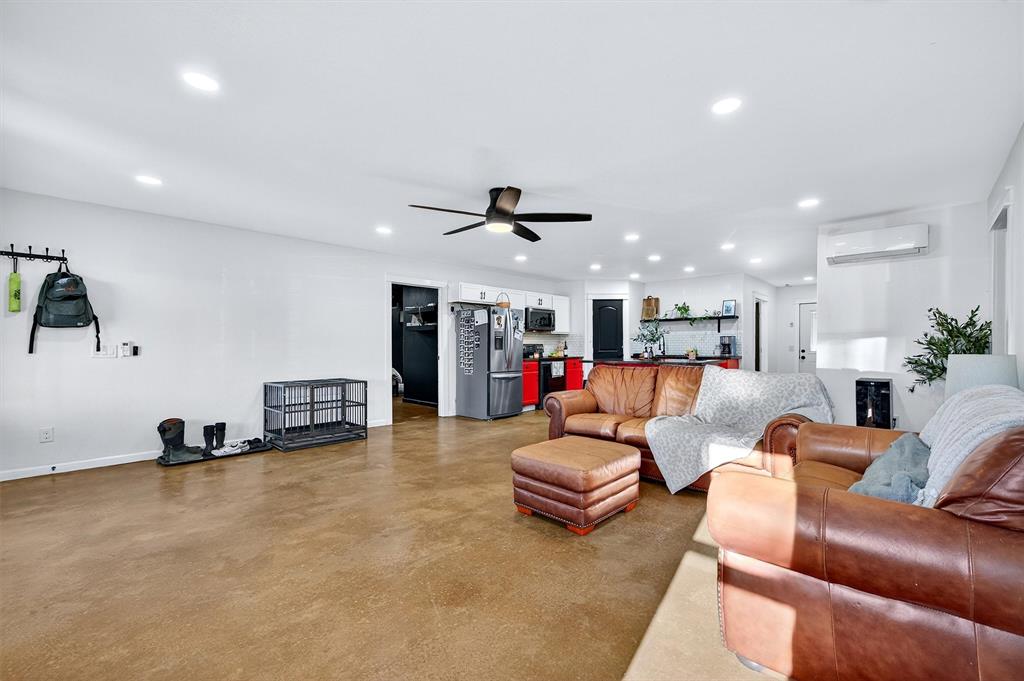 1700 Elmore Road Denison, TX 75021 - Photo 16 of 36 a living room with furniture and a large window