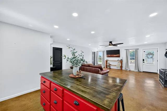 a kitchen with sink and view of kitchen
