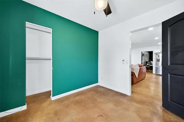 a view of a livingroom with a kitchen