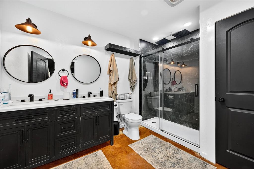 1700 Elmore Road Denison, TX 75021 - Photo 24 of 36 a bathroom with a double vanity sink mirror and shower