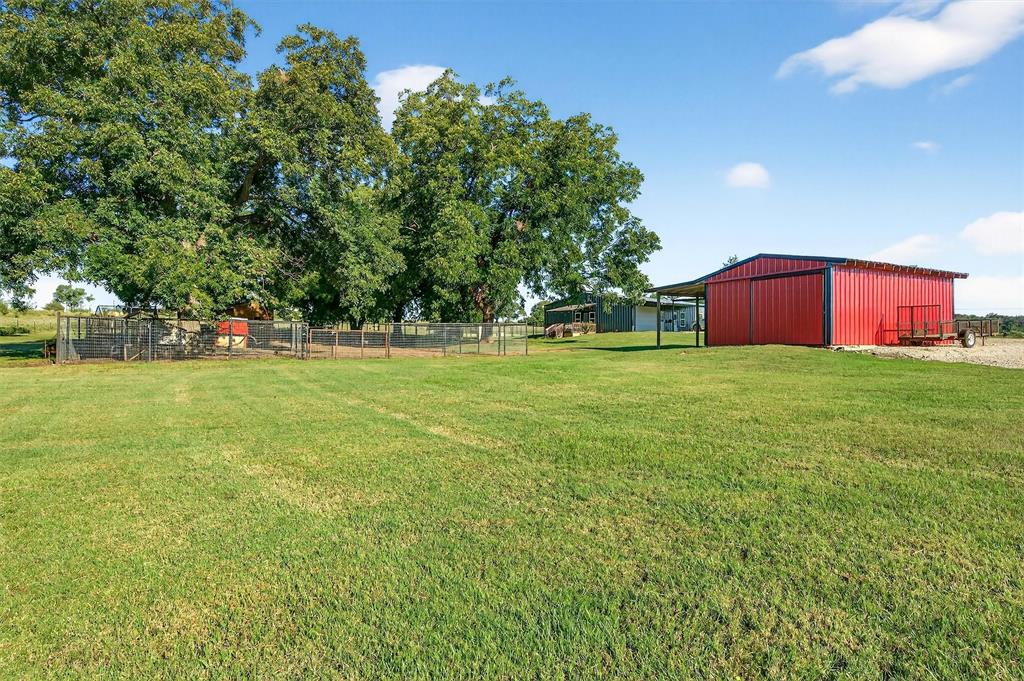 1700 Elmore Road Denison, TX 75021 - Photo 32 of 36 a view of a field of grass and trees