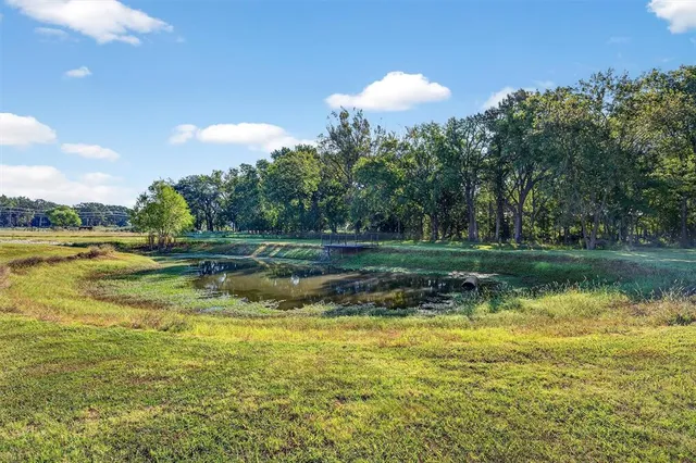 a view of a lake with a yard