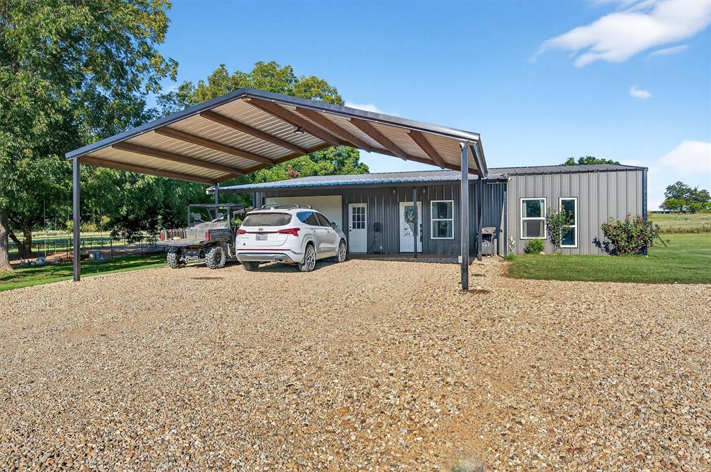 1700 Elmore Road Denison, TX 75021 - Photo 10 of 36 a car parked in front of house