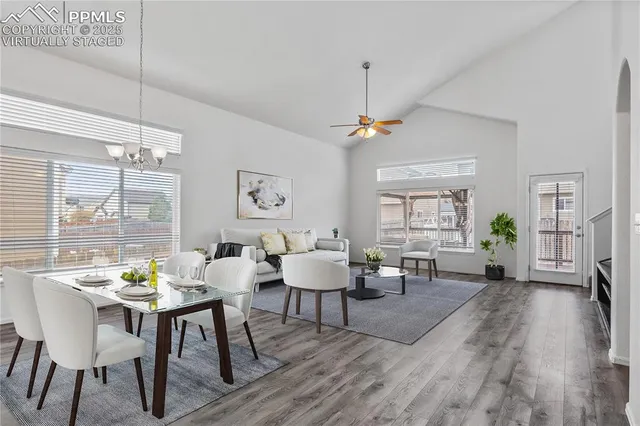 a view of a dining room with furniture window and wooden floor