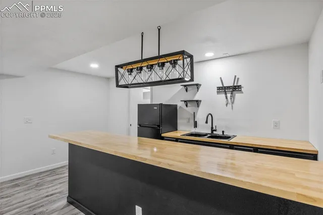 a kitchen with a sink and a stove