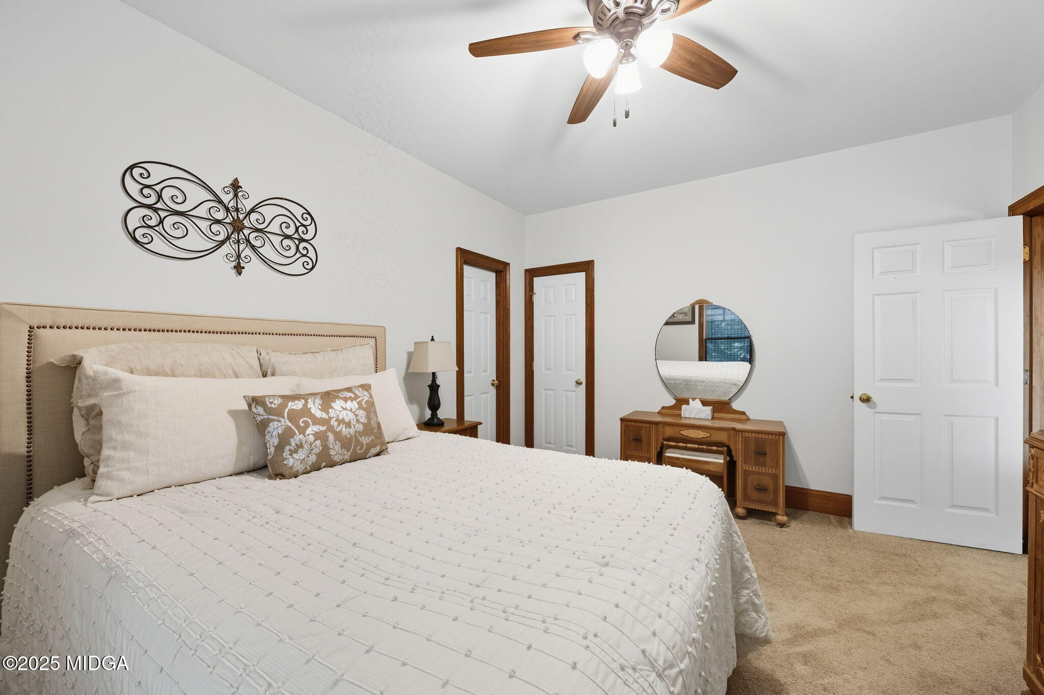 1969 Pate Road Macon, GA 31210 - Photo 20 of 48 a bedroom with a bed and a chandelier