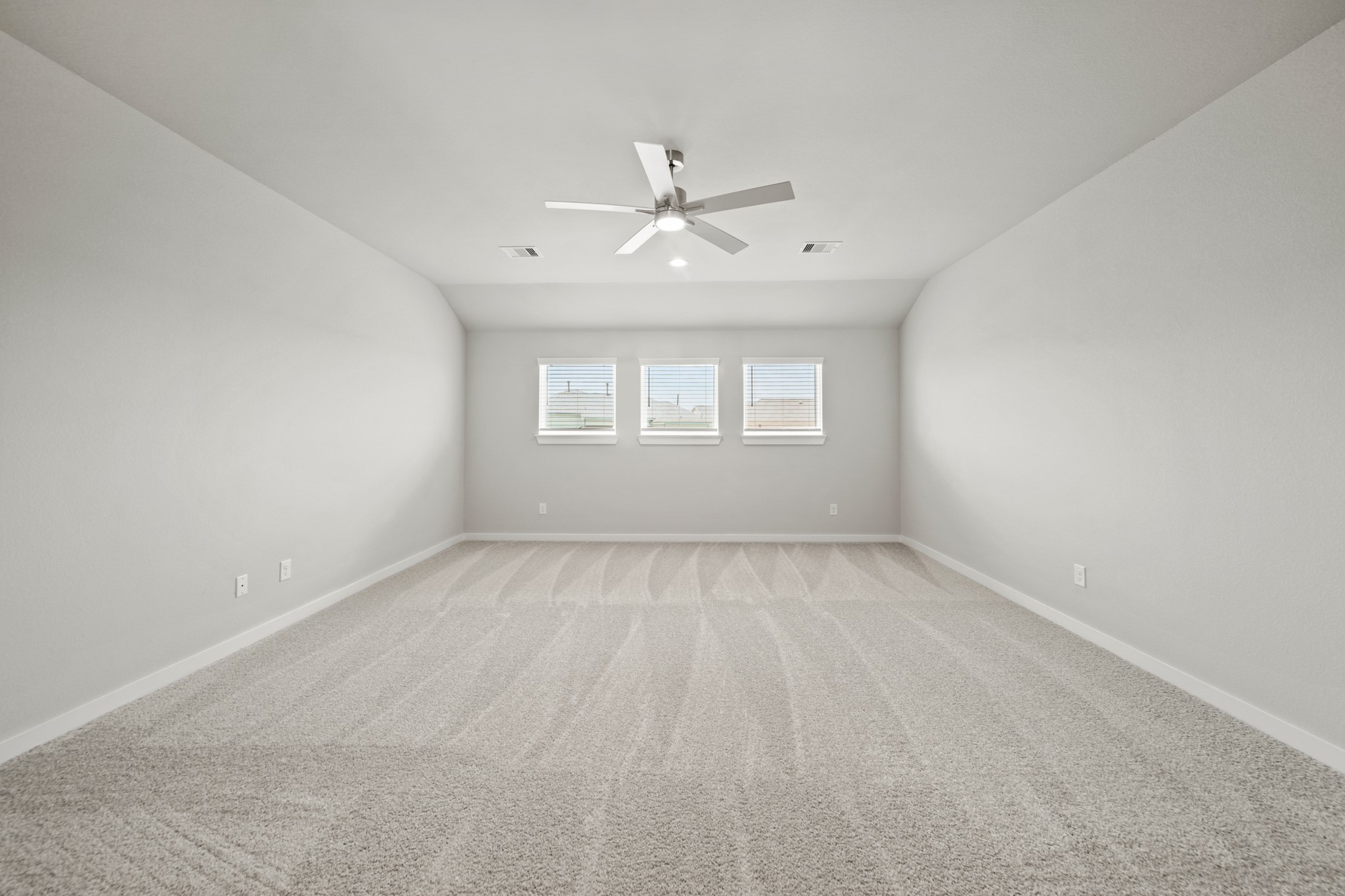 409 Inner Cove Lane Waller, TX 77484 - Photo 21 of 46 an empty room with a window and a ceiling fan