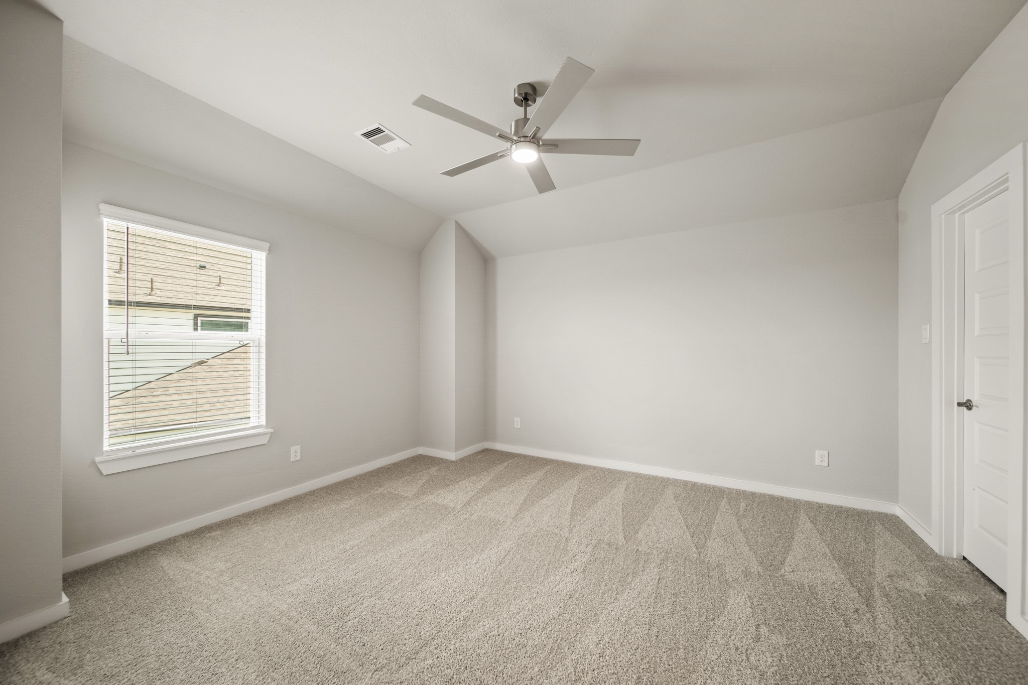 409 Inner Cove Lane Waller, TX 77484 - Photo 25 of 46 an empty room with ceiling fan and window
