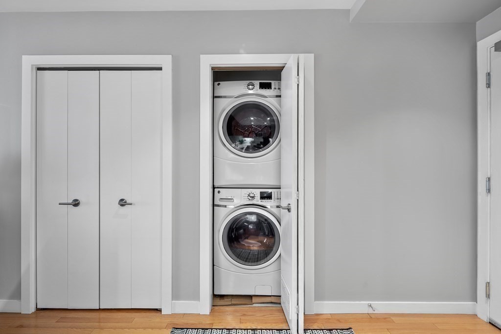 80 Broad Street, Unit 902 Boston, MA 02110 - Photo 17 of 30 a utility room with dryer and washer