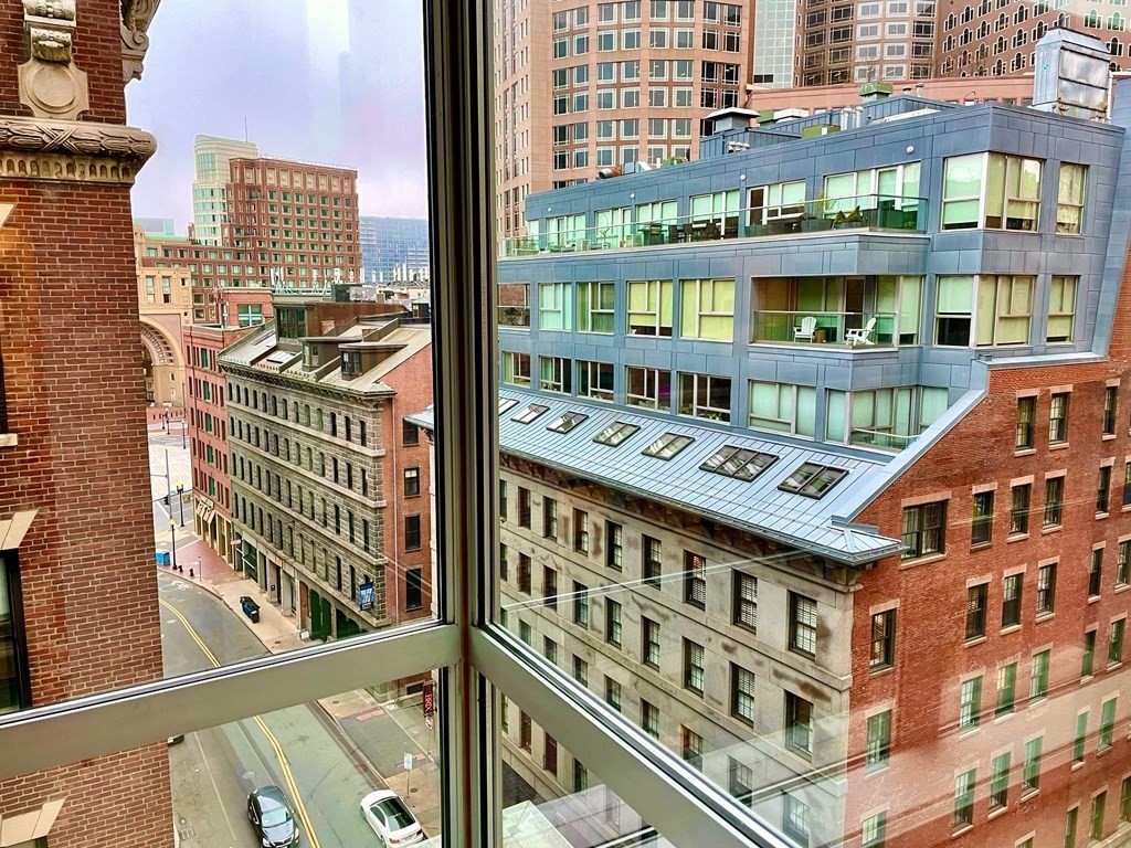 80 Broad Street, Unit 902 Boston, MA 02110 - Photo 8 of 30 a front view of a building with glass windows