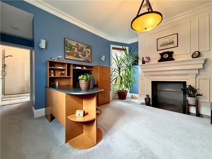 a view of a livingroom with furniture and a fireplace