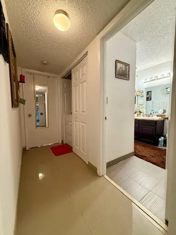 a bathroom with a double vanity sink toilet and shower