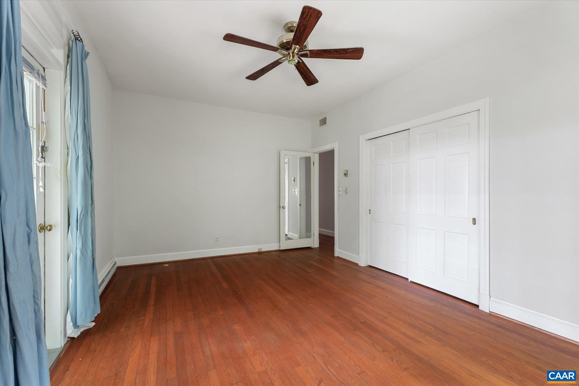 13320 Hackberry Road Orange, VA 22960 - Photo 15 of 47 a view of room with hardwood floor and a ceiling fan