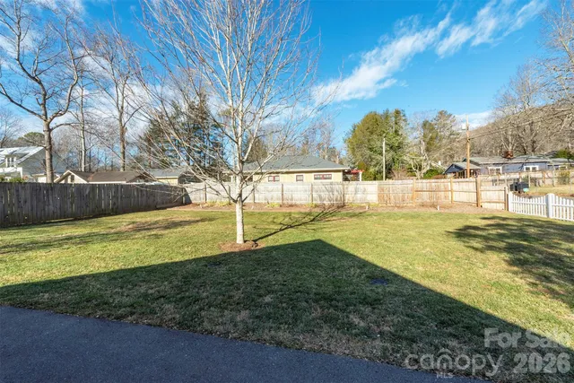 a view of yard with swimming pool