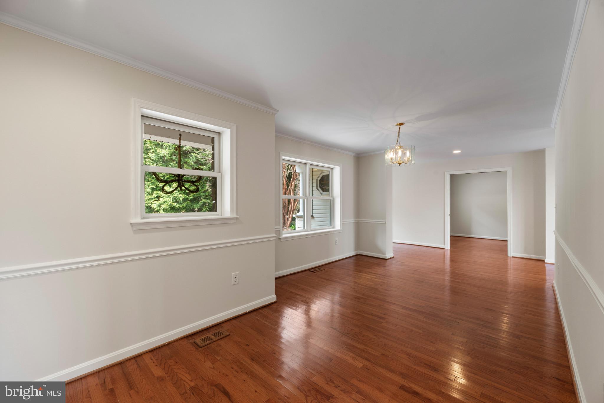 5929 Deale Beach Road Deale, MD 20751 - Photo 8 of 58 an empty room with wooden floor and windows