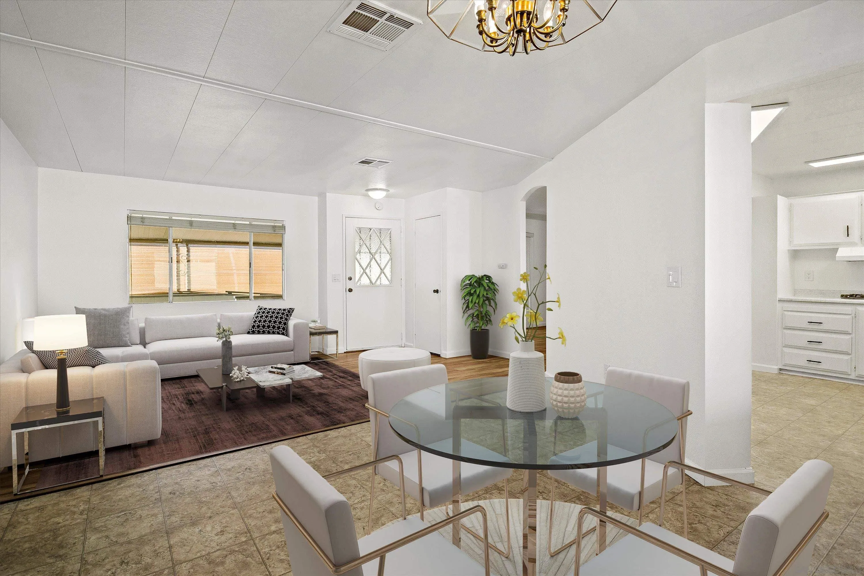 a living room with furniture and a potted plant