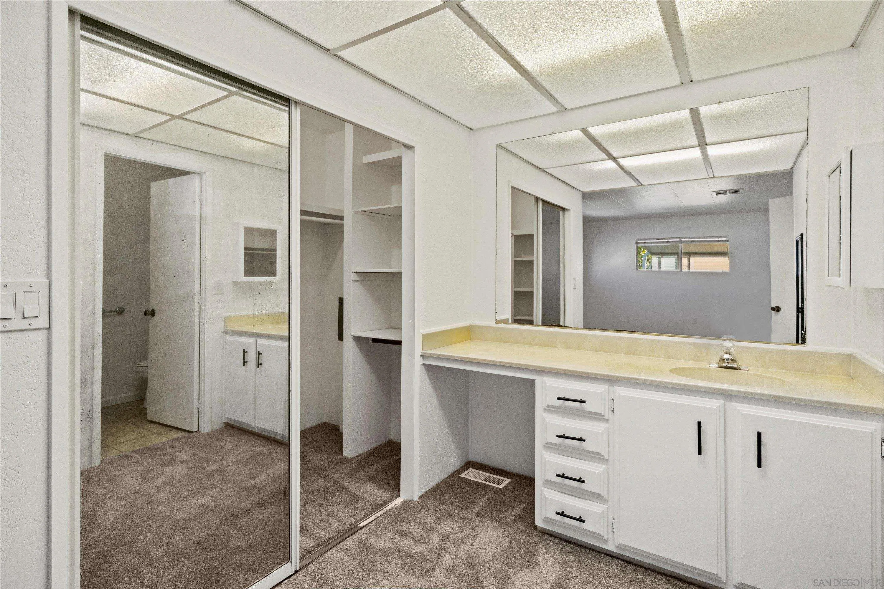 1925 Otay Lakes Road Chula Vista, CA 91913 - Photo 11 of 27 a bathroom with a sink and a mirror
