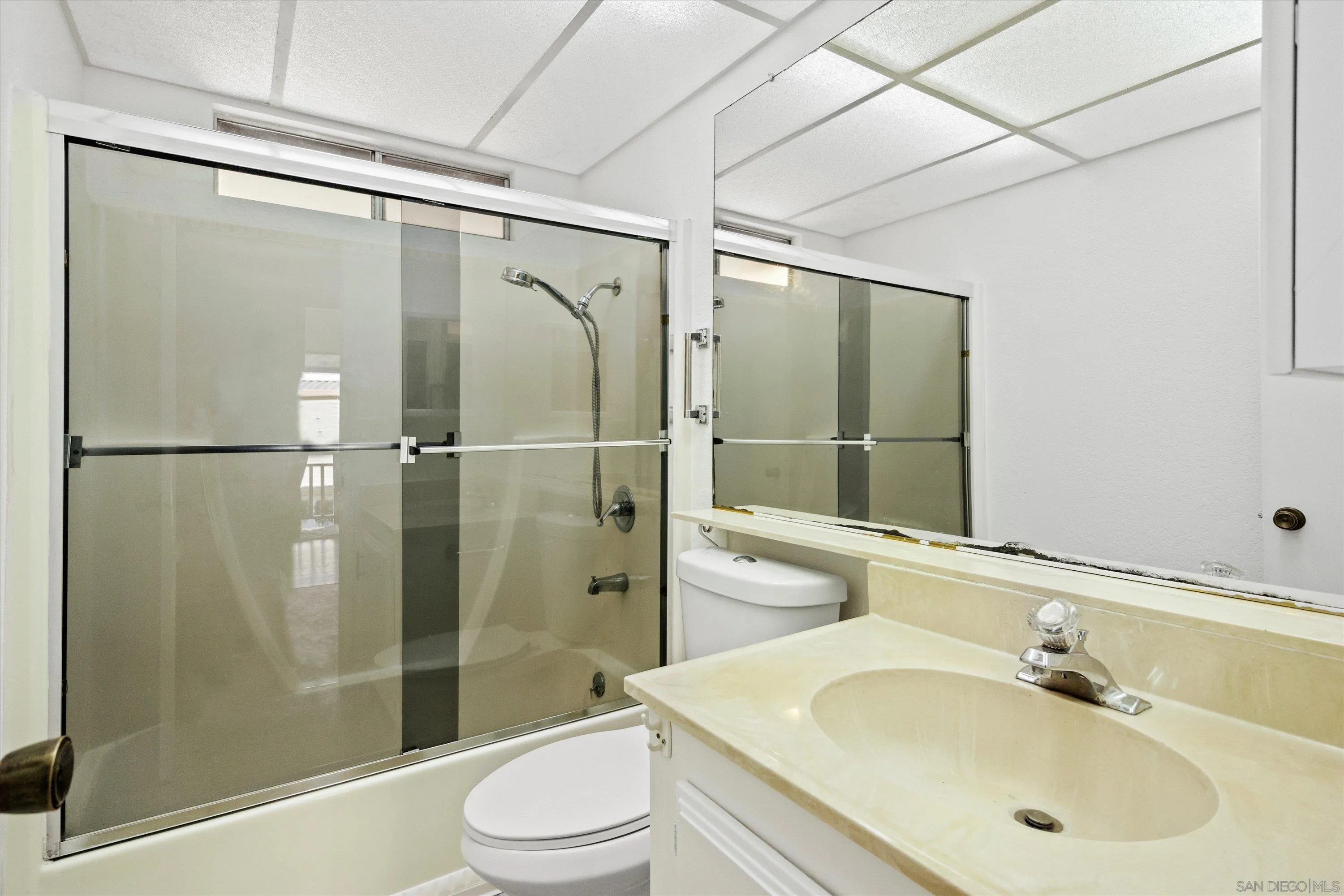 1925 Otay Lakes Road Chula Vista, CA 91913 - Photo 18 of 27 a bathroom with a shower sink vanity mirror and toilet