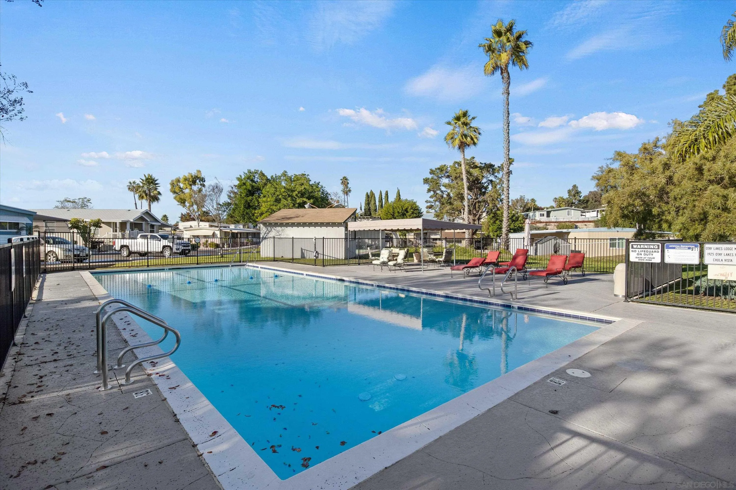 1925 Otay Lakes Road Chula Vista, CA 91913 - Photo 23 of 27 a view of a swimming pool with a table and chairs