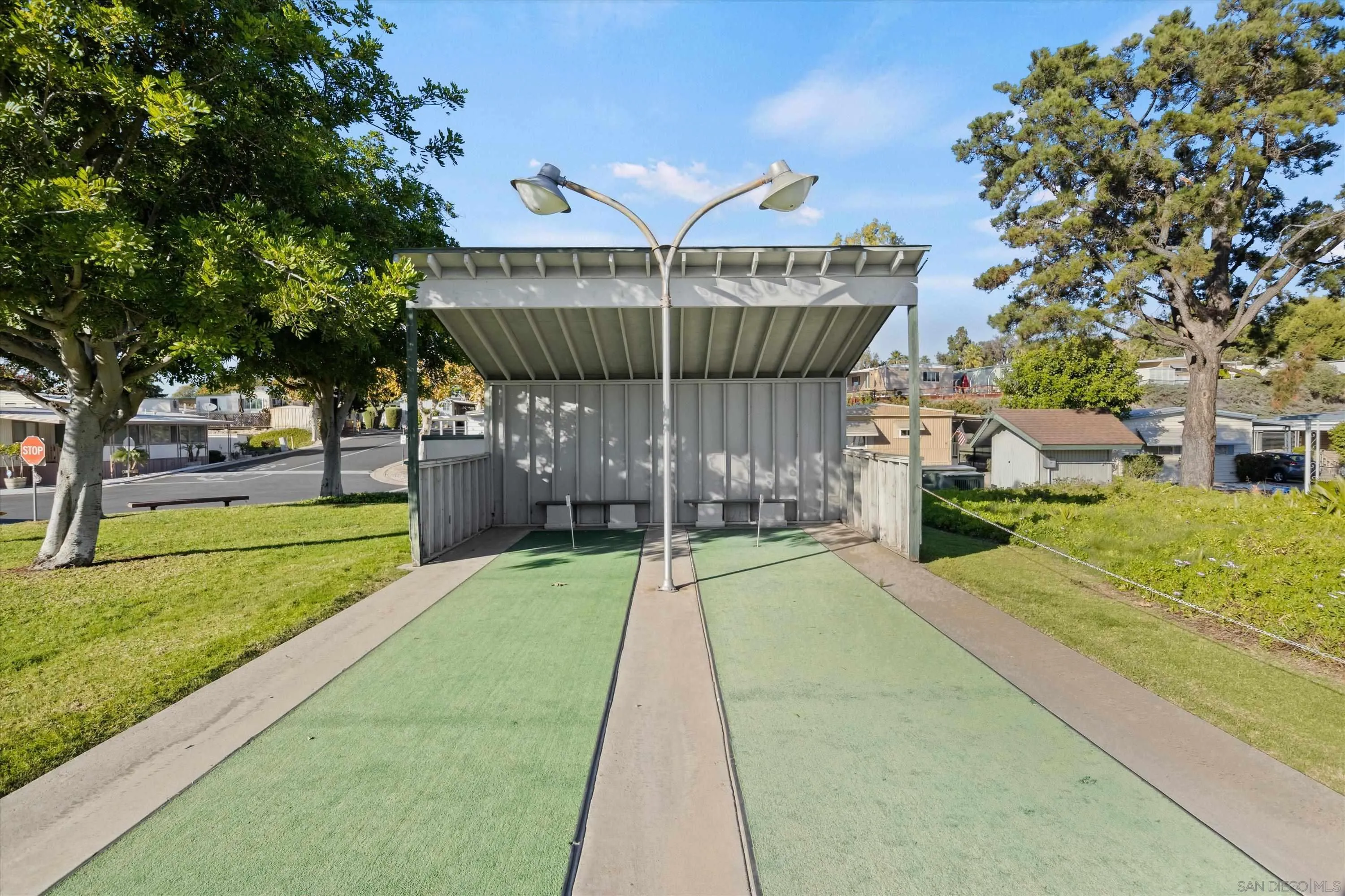 1925 Otay Lakes Road Chula Vista, CA 91913 - Photo 24 of 27 a view of a house with a big yard and large tree