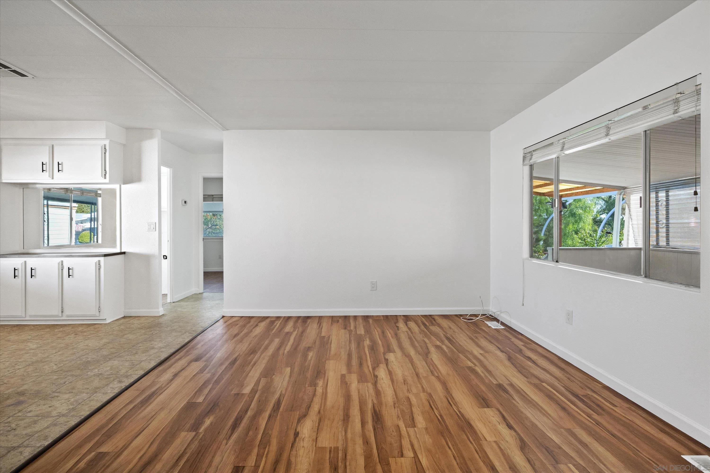 1925 Otay Lakes Road Chula Vista, CA 91913 - Photo 7 of 27 a view of a room with wooden floor and a window