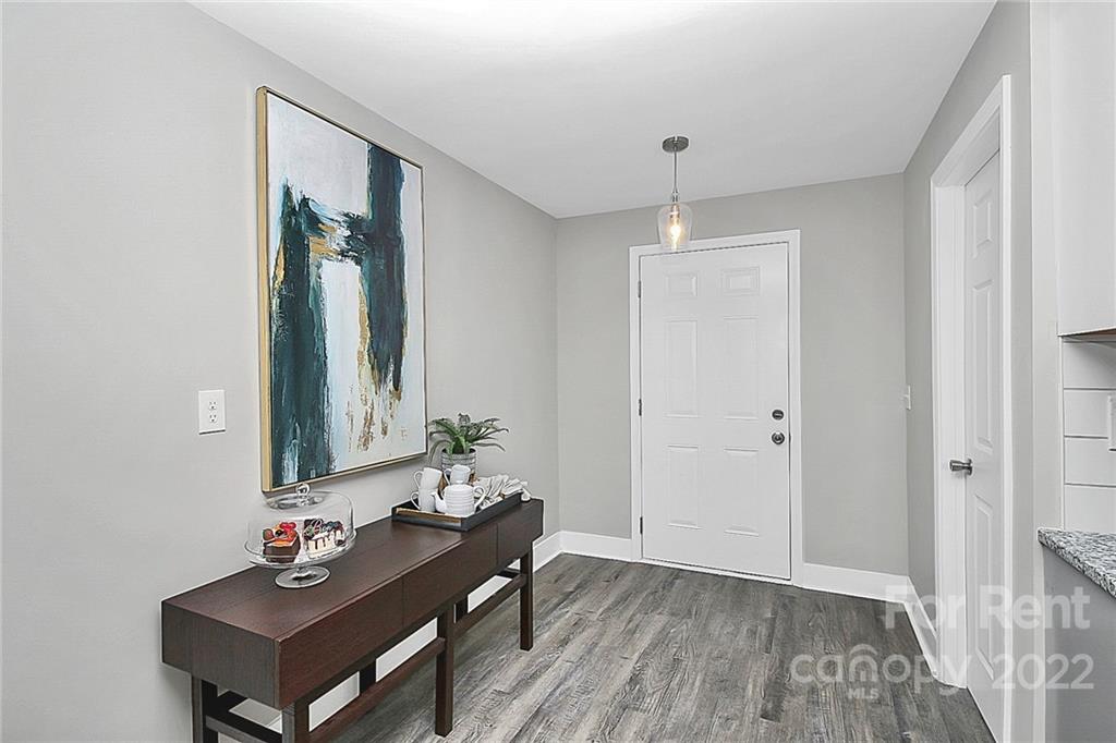 824 South Ridge Avenue, Unit 4 Kannapolis, NC 28083 - Photo 20 of 30 a living room with furniture and a mirror
