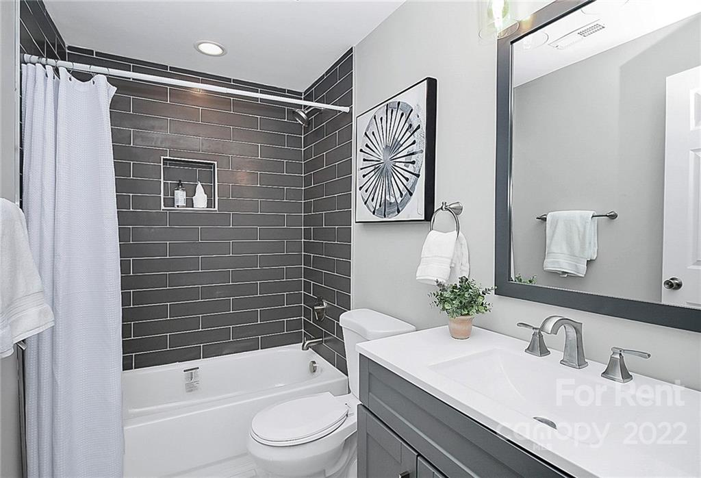 824 South Ridge Avenue, Unit 4 Kannapolis, NC 28083 - Photo 21 of 30 a bathroom with a sink toilet and shower