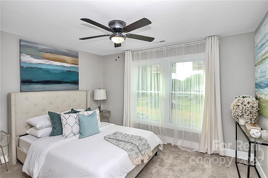 824 South Ridge Avenue, Unit 4 Kannapolis, NC 28083 - Photo 22 of 30 a bedroom with a large bed and a tv