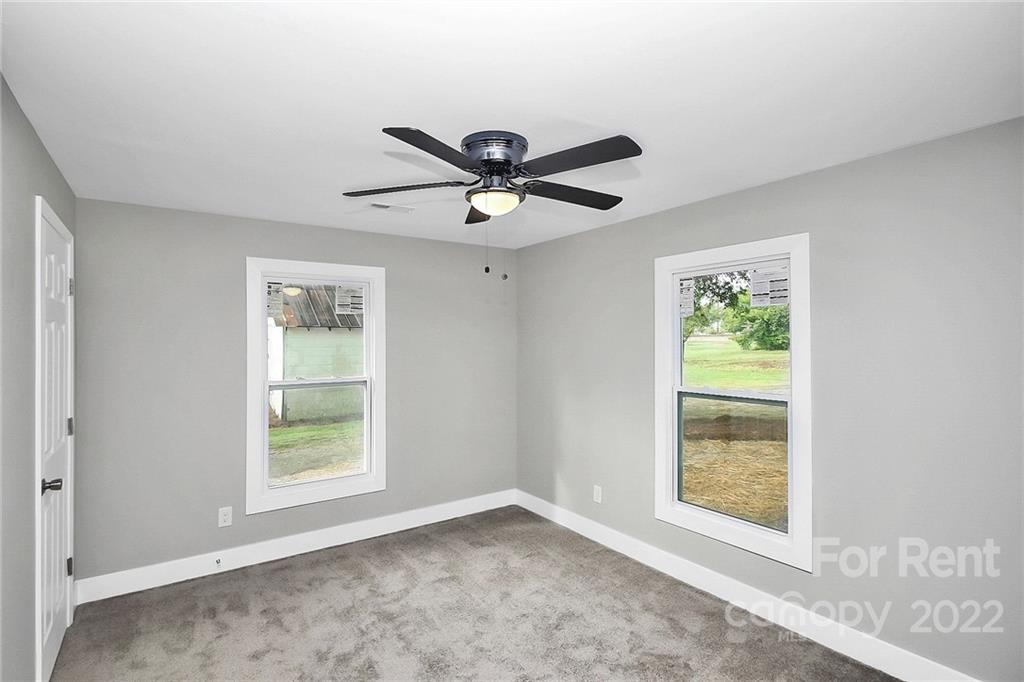 824 South Ridge Avenue, Unit 4 Kannapolis, NC 28083 - Photo 24 of 30 a view of a livingroom with a window and a ceiling fan