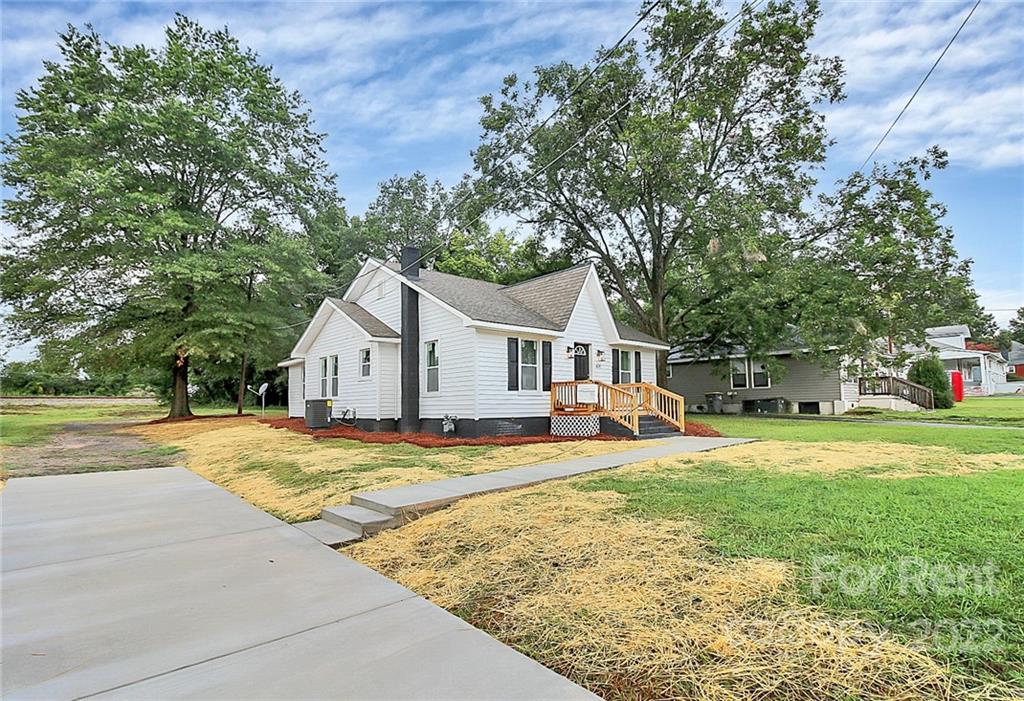 824 South Ridge Avenue, Unit 4 Kannapolis, NC 28083 - Photo 30 of 30 a front view of a house with a yard and trees