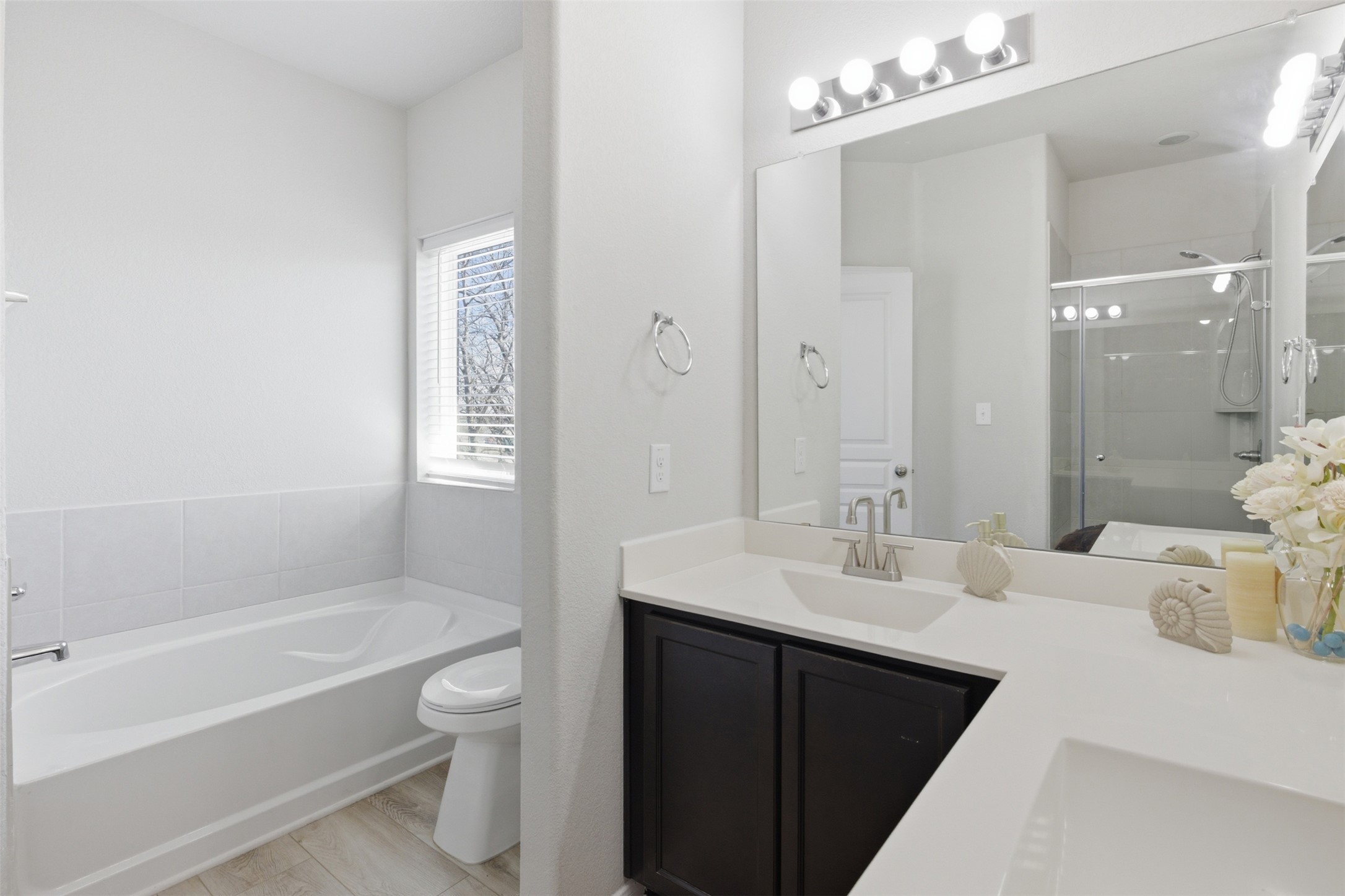 480 Waterloo Drive Kyle, TX 78640 - Photo 11 of 23 Full bath with a bath, double vanity, and a shower stall