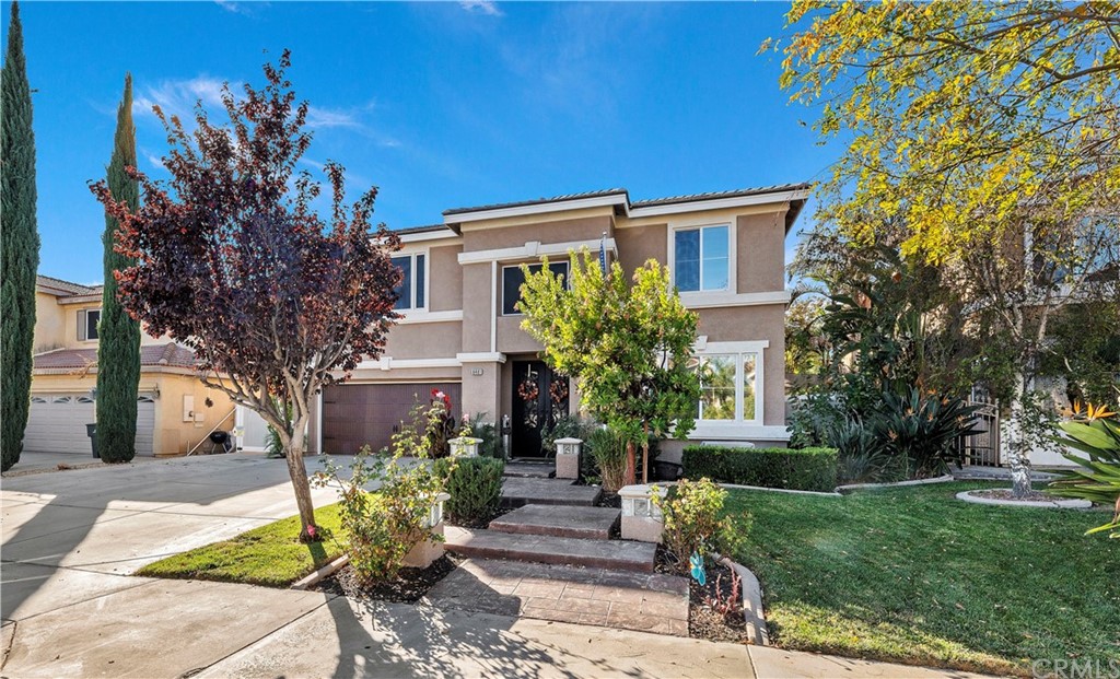 8481 Monique Court Riverside, CA 92508 - Photo 1 of 1 a front view of a house with garden