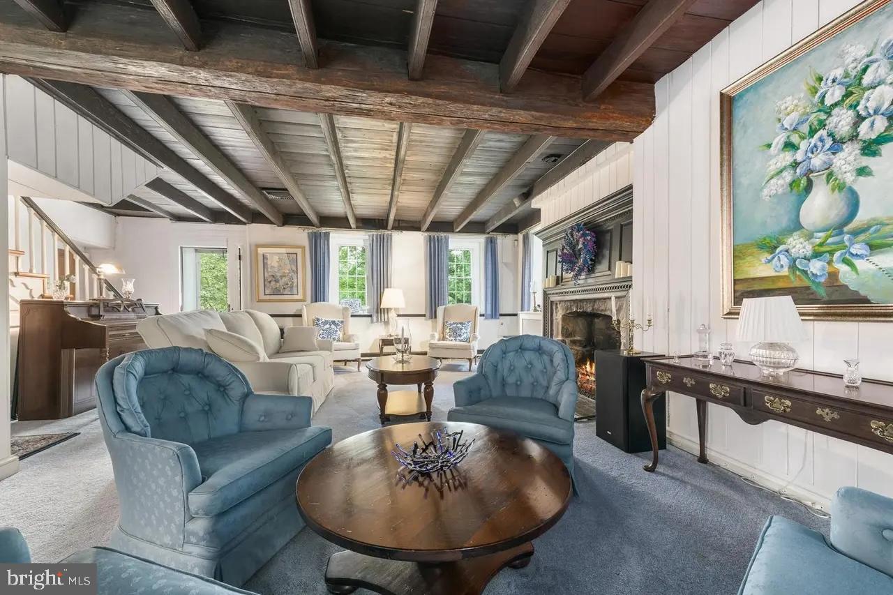 908 Lincoln Road Phoenixville, PA 19460 - Photo 7 of 26 Charming living space with rustic beams.