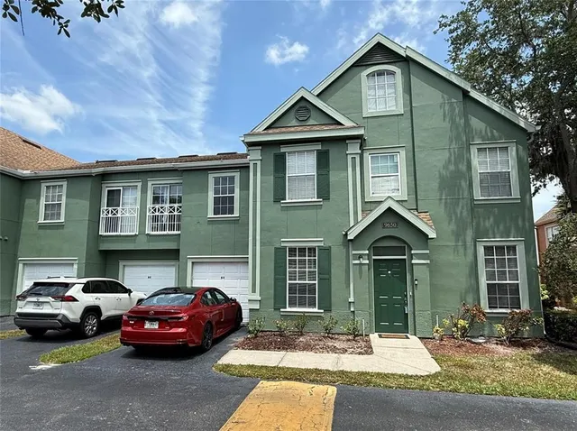 a front view of a house with parking space