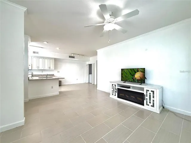 a view of kitchen with kitchen island microwave and stove