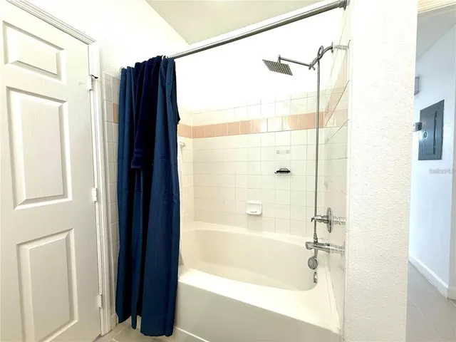 a bathroom with a shower and a tub