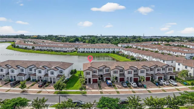 an aerial view of a house with outdoor space