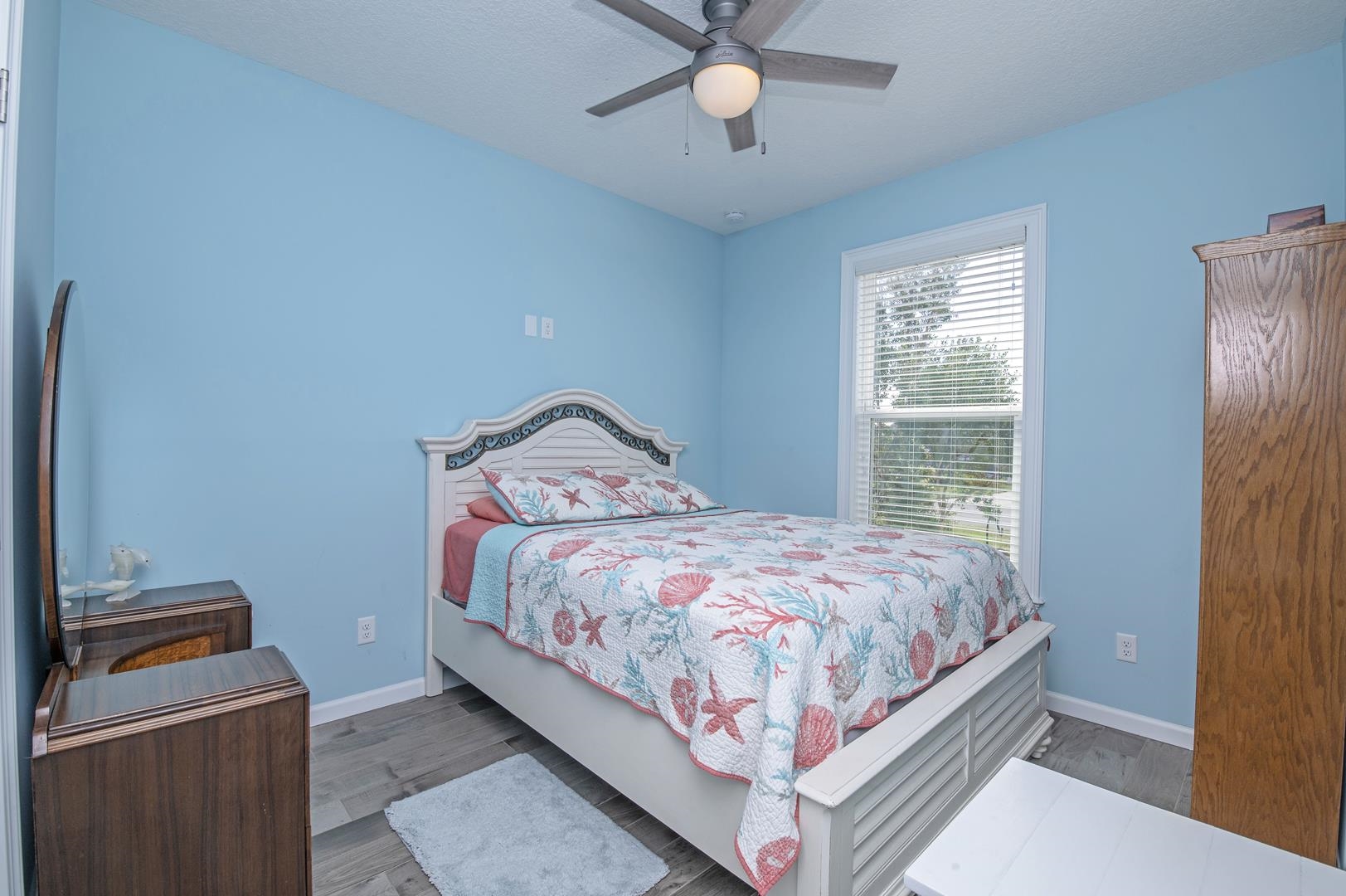 6056 Costanero Road St. Augustine, FL 32080 - Photo 11 of 30 Bedroom with wood finished floors and ceiling fan