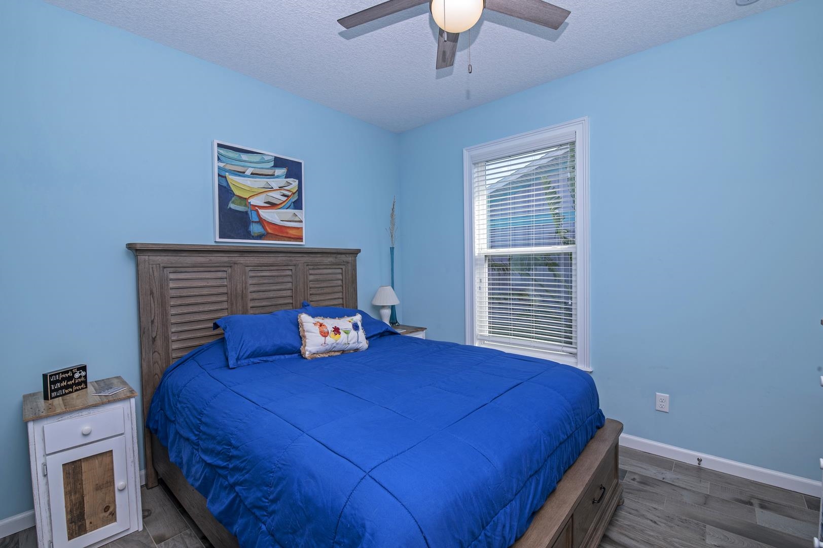 6056 Costanero Road St. Augustine, FL 32080 - Photo 16 of 30 Bedroom featuring a textured ceiling, wood finished floors, and ceiling fan