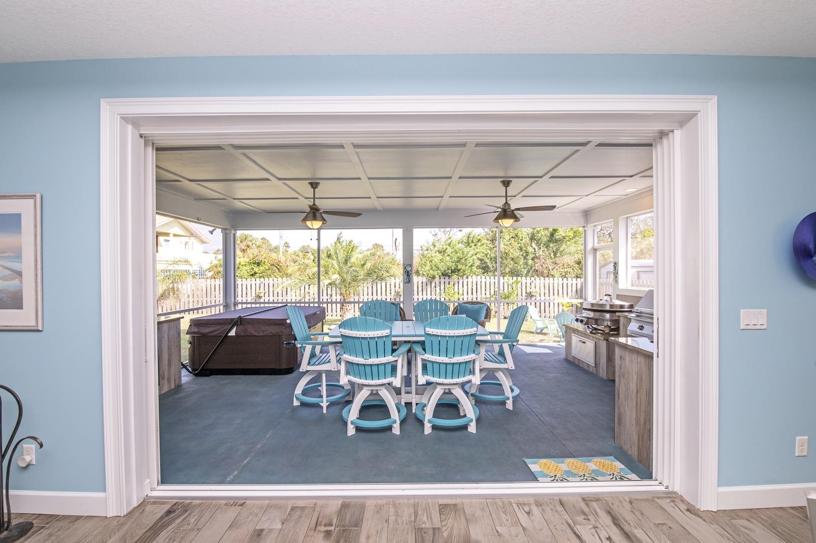 6056 Costanero Road St. Augustine, FL 32080 - Photo 21 of 30 Dining room with ceiling fan, a sunroom, and dark wood finished floors