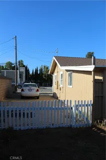 a view of house with a yard