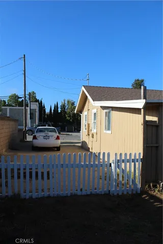 a view of house with a yard