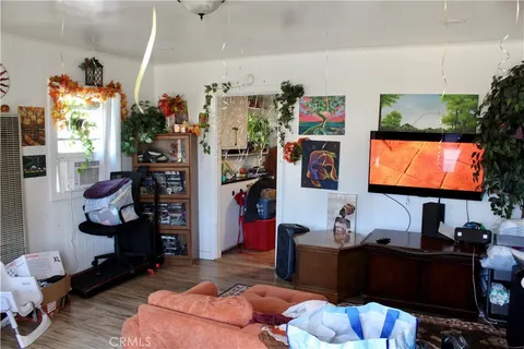 a room with furniture and a flat screen tv