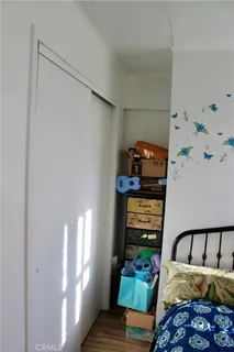a bedroom with a bed and with on the wall