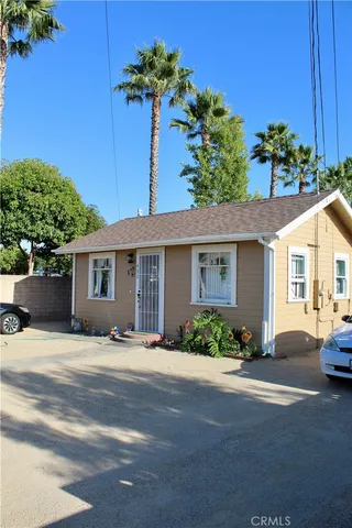 a front view of a house with a yard and a garage