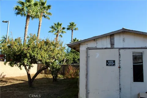 a view of a house with a flower garden