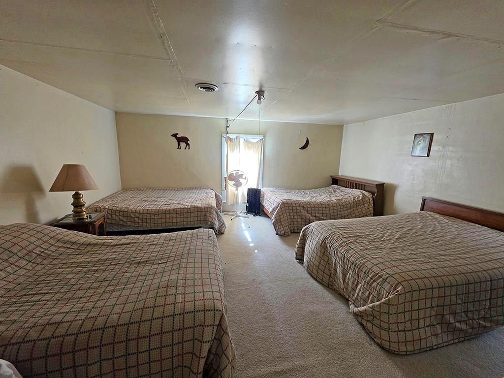 3188 Winslow Hill Road Benezett, PA 15821 - Photo 11 of 27 a bedroom with two beds and painting on the wall