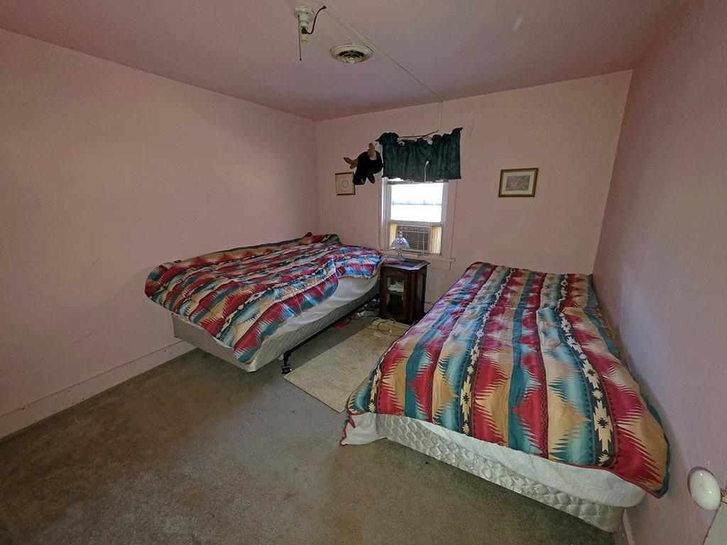 3188 Winslow Hill Road Benezett, PA 15821 - Photo 14 of 27 a bedroom with two beds and lamp